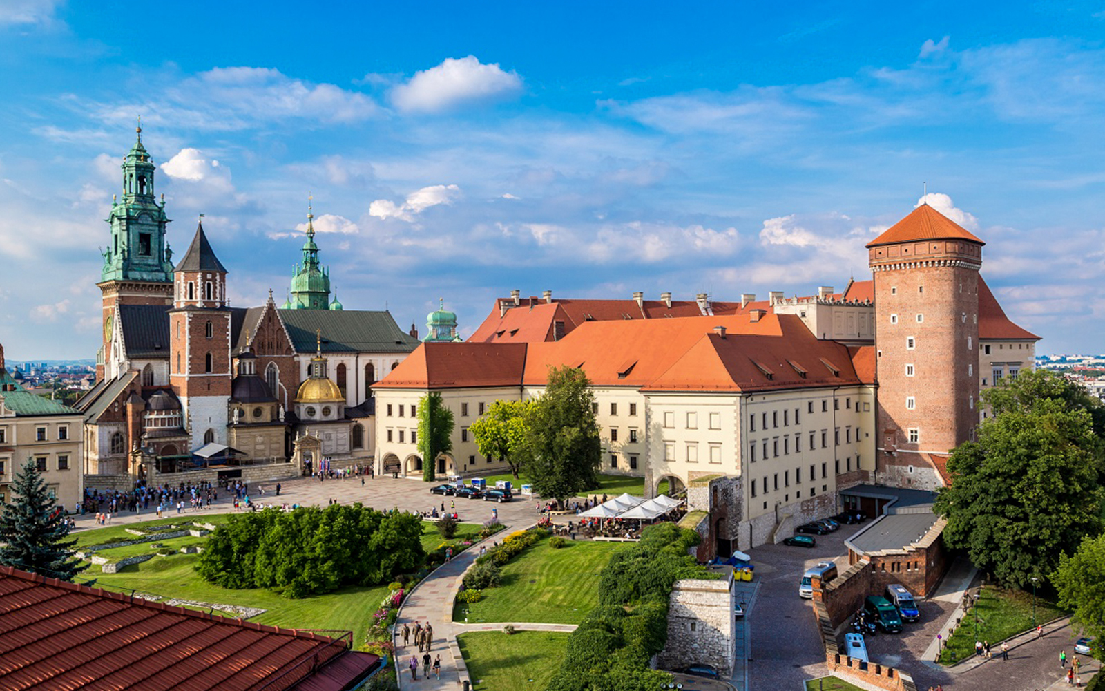 View of Wawel Castle above the Vistula River at sunrise, elegant and peaceful.