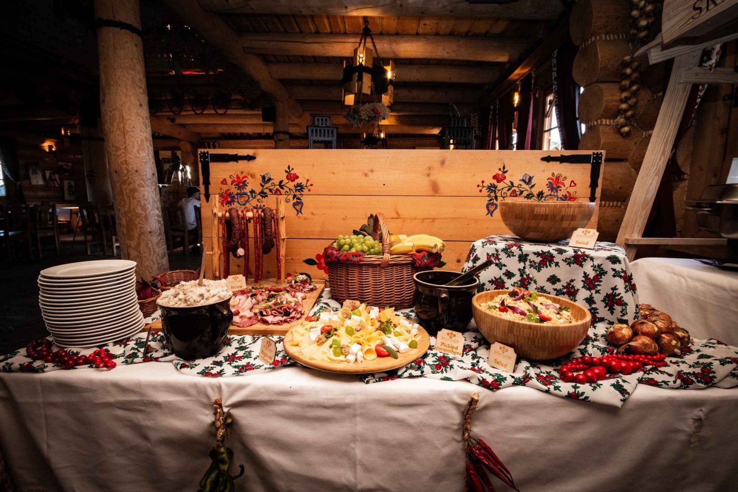 Traditional pierogi and local vodka on a rustic table in Kraków’s Kazimierz.
