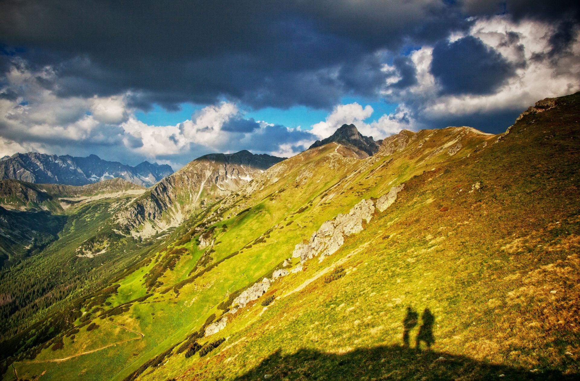 Couple admiring mountain peaks near Morskie Oko or Gubałówka viewpoint.
